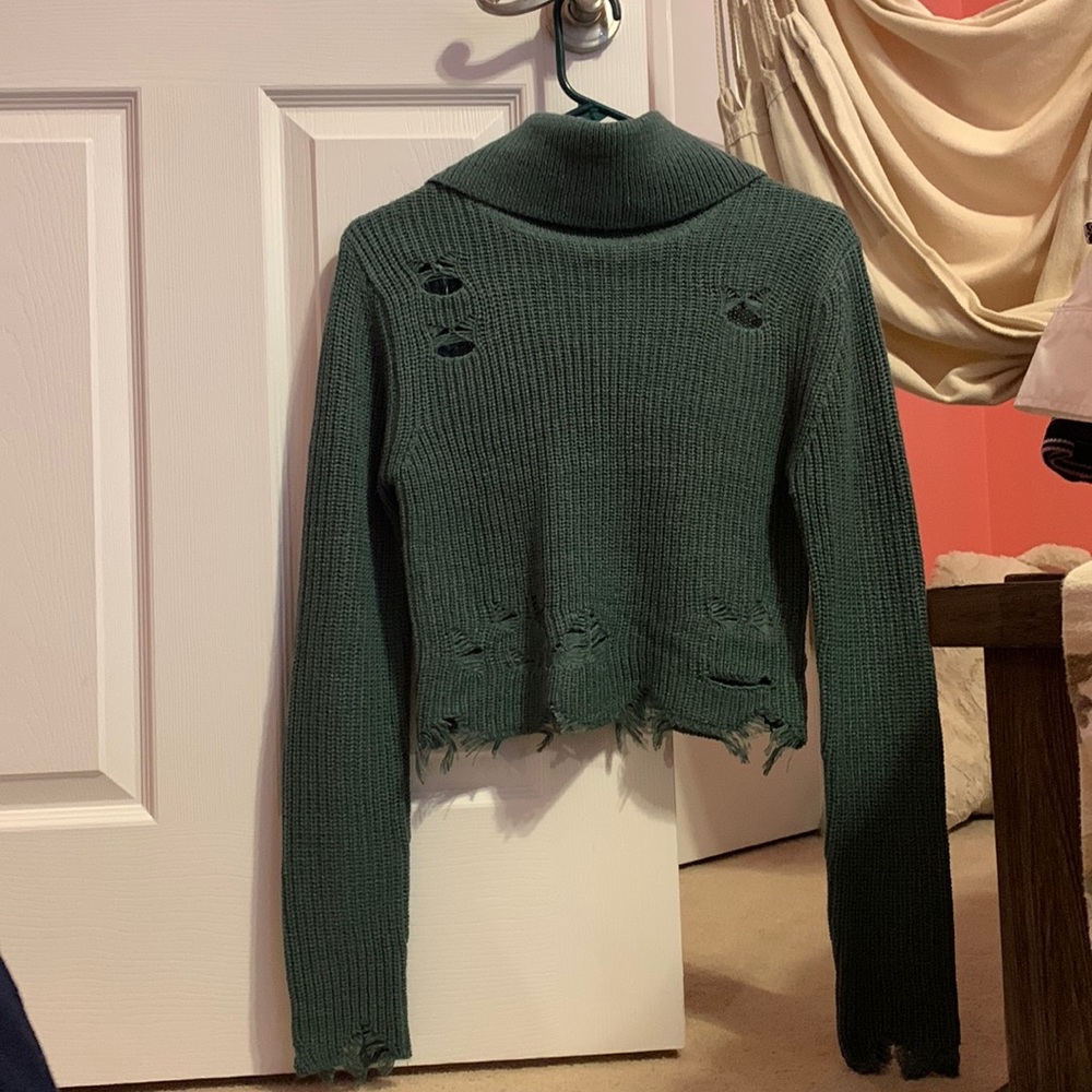 blueish-green sweater